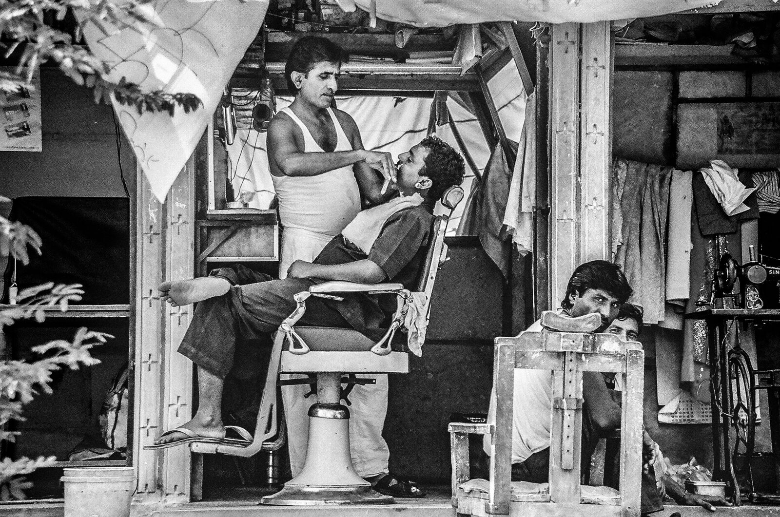 Barber at work at SignalCuts Barbershop