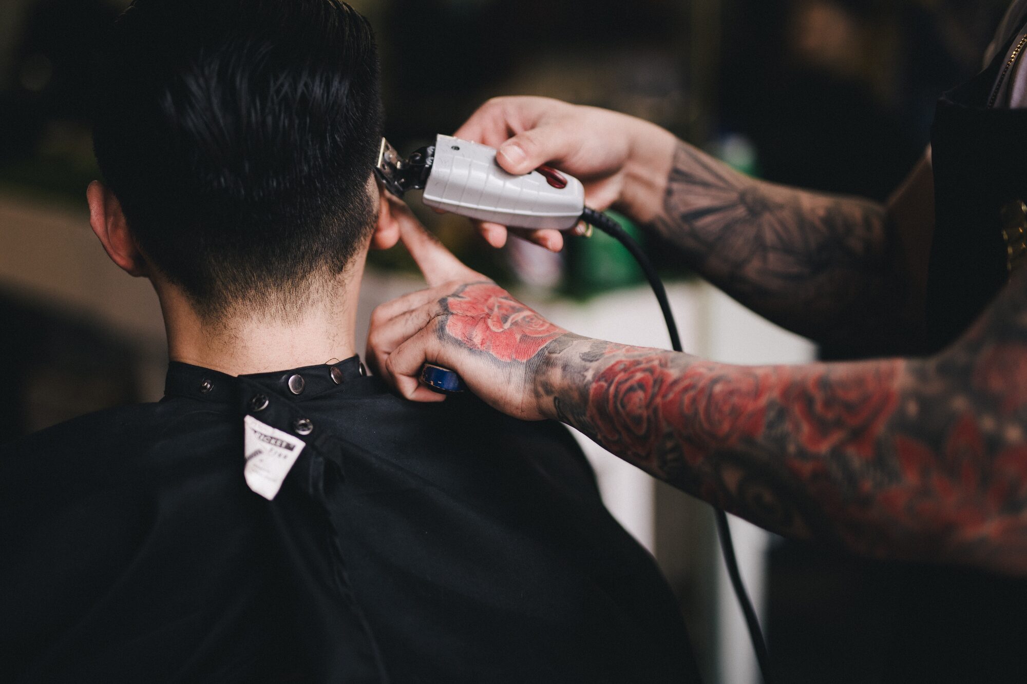 Barber at work inside SignalCuts Barbershop